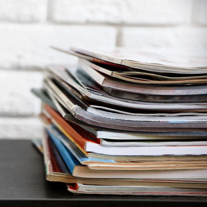 Stack of magazines on table, close up